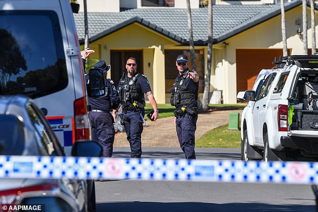 Shocked neighbours say Coolidge Court is a quiet and peaceful street and that the occupants who lived at the home kept to themselves (pictured, police in the cordoned off street)