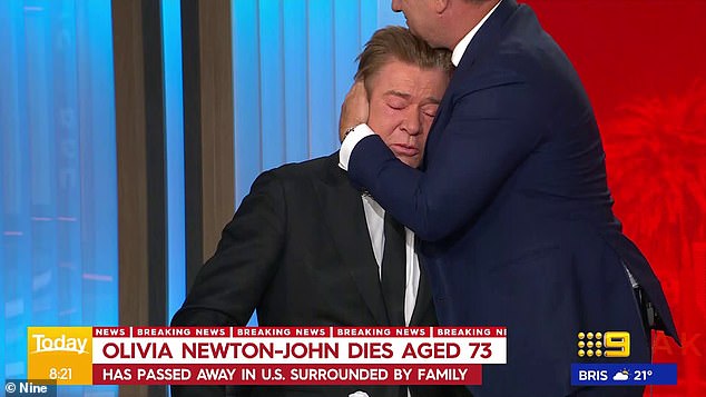 Host Karl Stefanovic left his seat on the panel to comfort his colleague who wiped his eyes