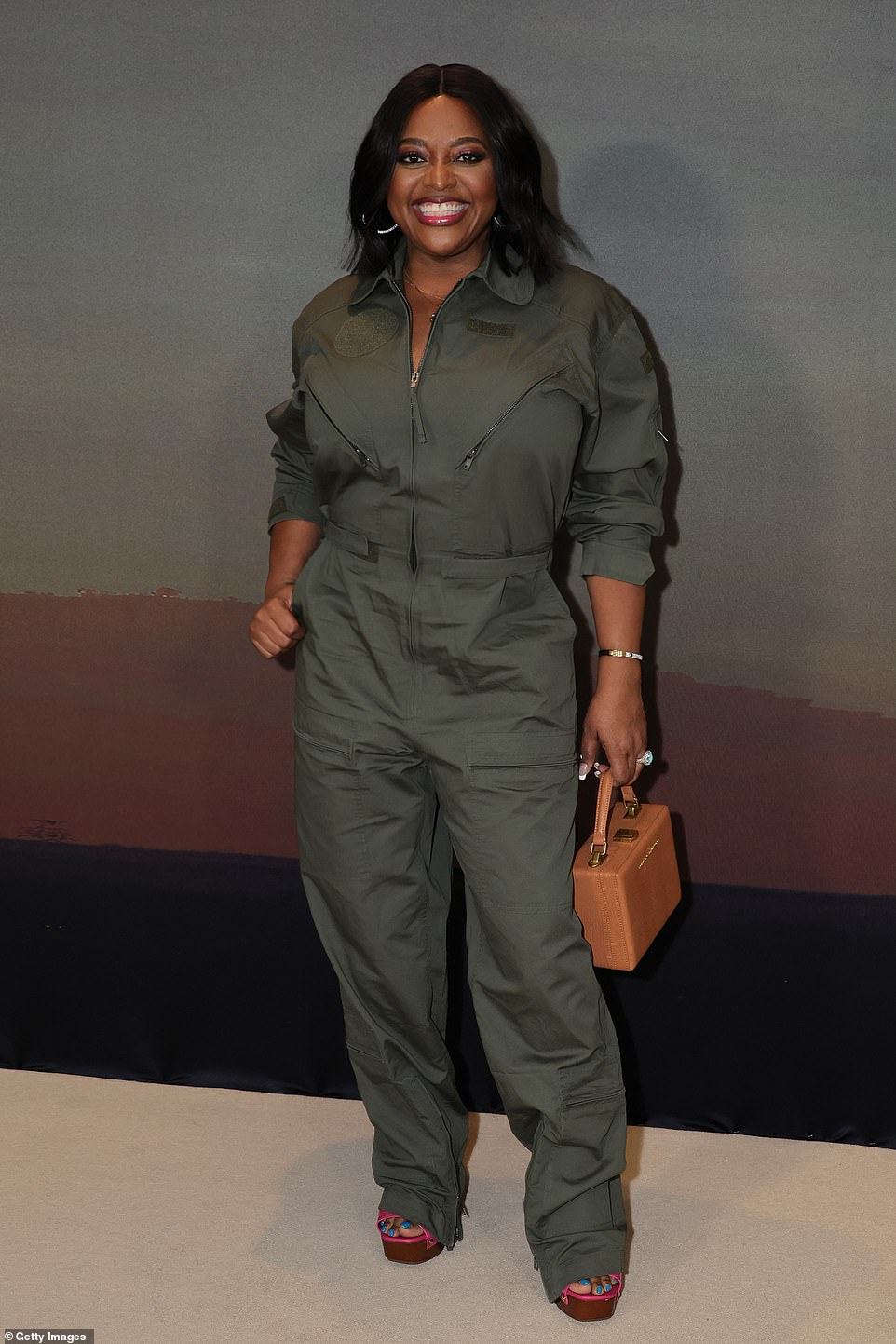 Suited up: Sherri Shepherd beamed ear-to-ear a she arrived at the premiere. The TV host, who is taking over Wendy Williams' old time slot, wore a sleek olive jumpsuit with the sleeves rolled up