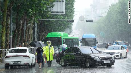 Vehicles that had been submerged by heavy rainfall block a road in Seoul, South Korea on August 9.