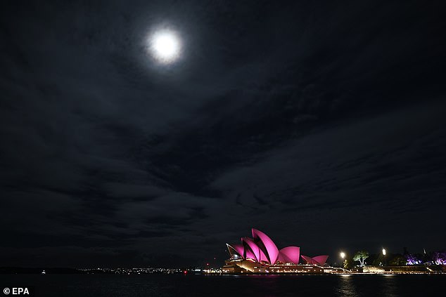 In a breath-taking show of love, the iconic landmark in the Harbour City was drenched in a stunning shade of fuchsia to commemorate Newtown-John's life and legacy