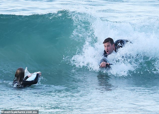 Close watch: Chris kept an eagle eye on India as she struggled with her kickboard