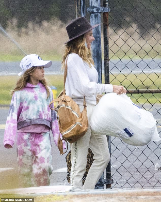 The glamourous star sported a casual look, wearing a baggy white top, cream trousers and a black wide brim hat