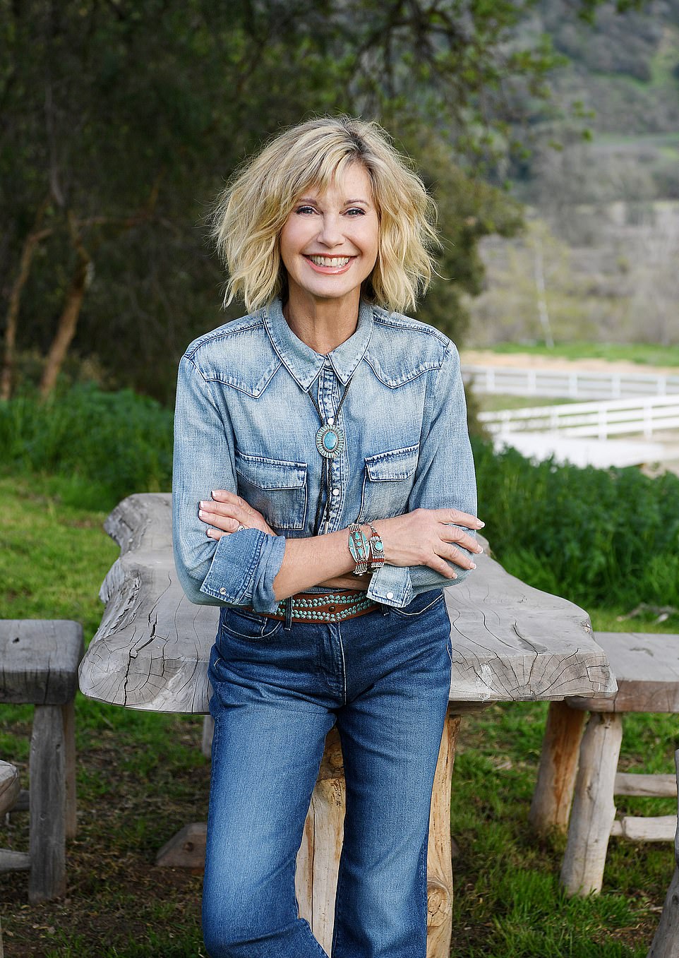 Changing it up: Olivia has always said she was reluctant to take on the role of a student  as a 28-year-old actress and she couldn't do an American accent. So producer Allan Carr allowed her to be an Australian transfer student (pictured on the cover of her book in 2019)