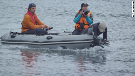 (From left) Enrique Haag Rodriguez, Carla Christie and Mauricio Handler film Chilean dolhpins in Chile&#39;s Gulf of Corcovado.