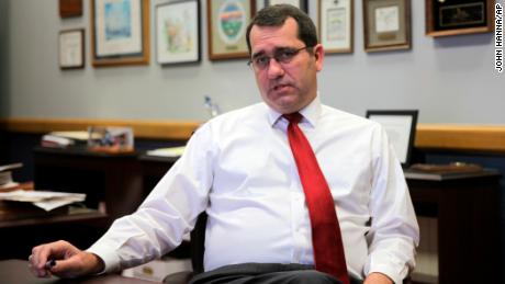 In this photo from Monday, Dec. 6, 2021, Kansas Attorney General Derek Schmidt answers questions during an interview in his office in Topeka, Kan. Schmidt,  a Republican running for governor, has issued a legal opinion saying an anti-abortion measure up for a statewide vote would not hinder medical care for women facing life-threatening pregnancies. 