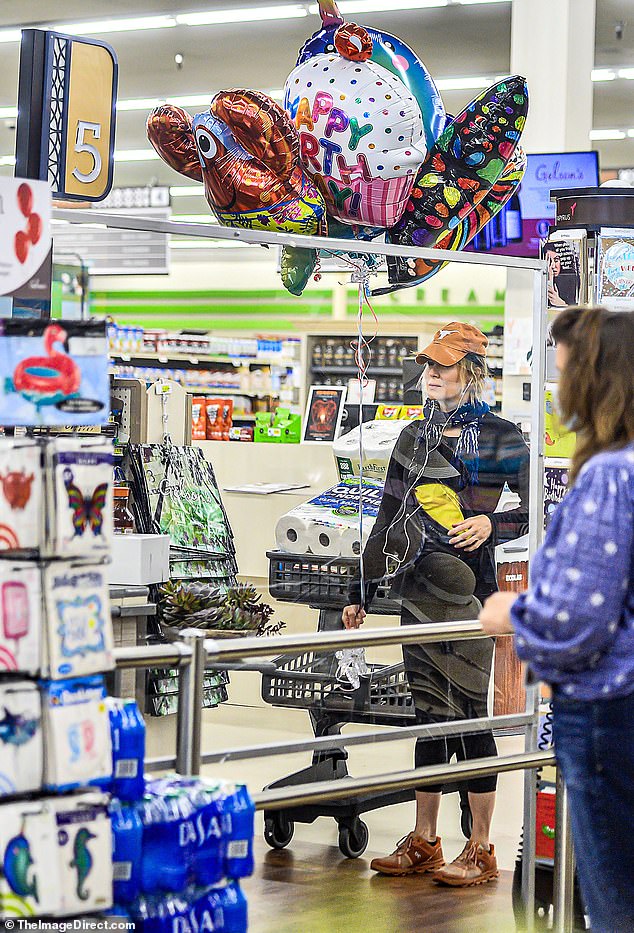 Patience: Zellweger patiently stood in the market line and waited to check out