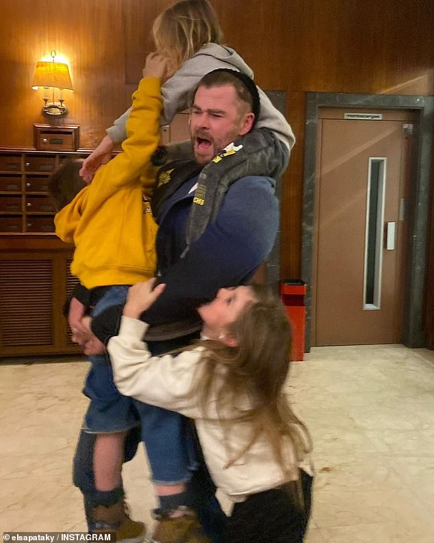 Elsa uploaded the photo alongside two others, including one of the Thor star wrestling with their three children: daughter India, nine, and twin boys Sasha and Tristan, both eight (all pictured here)