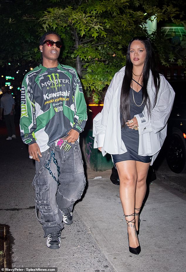 Stylish: A$AP - real name Rakim Mayers - opted for an eye-catching ensemble as he teamed a green patterned shirt and baggy grey jeans