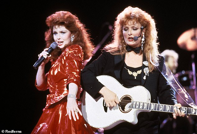 Naomi and Wynonna pictured in their heyday. A source close to Wynonna alleged the singer is angry she was excluded from Naomi Judd's will and 'believes she was a major force behind her mother's success. The duo were inducted into the Country Music Hall of Fame one day after Judd's death was announced