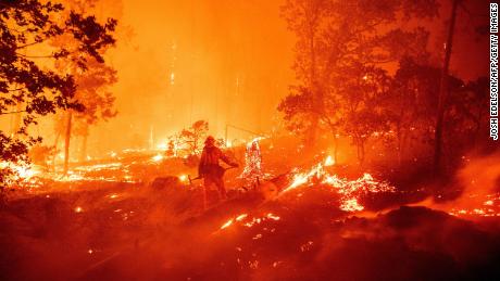 A firefighter battles flames during the Creek Fire in Madera County, California, in September  2020.