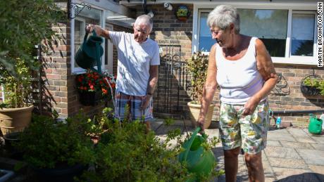 David and Margaret Miller water their plants at their home in Edenbridge.