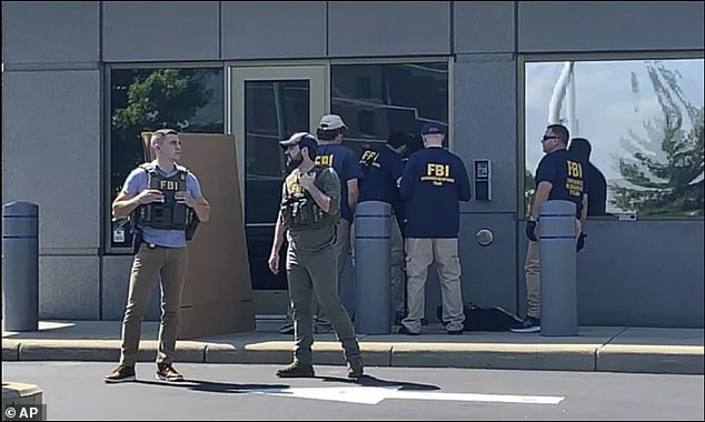 Law enforcement officers have killed the armed man who attacked the FBI 's field office in Cincinnati, Ohio