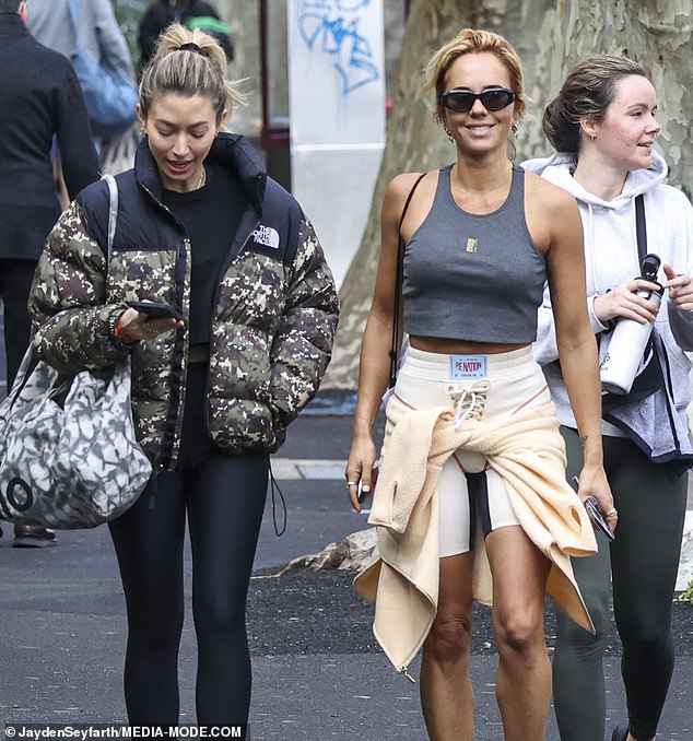 Meanwhile, her best friend Milly kept it simple with a black-on-black outfit of tights, crop-top and sneakers