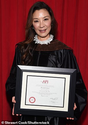 Graduation attire: The 60-year-old Crouching Tiger, Hidden Dragon star donned black graduation robes and a brown sash on her shoulders