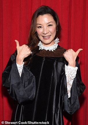 Graduation attire: The 60-year-old Crouching Tiger, Hidden Dragon star donned black graduation robes and a brown sash on her shoulders