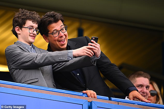 Fun: Also in attendance was Michael McIntyre who appeared in high spirits as a fan snapped a selfie with him while watching the game