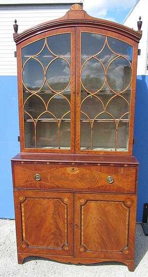 The Georgian bookcase, pictured, could go for up to £800