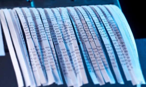 Strips of paper coming out of a shredder.