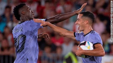 Vázquez celebrates scoring the equalizing goal against Almería with Vinicius Júnior.