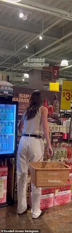 Proud moment: The businesswoman was seen walking over to her 818 tequila brand and adding a bottle into her shopping basket