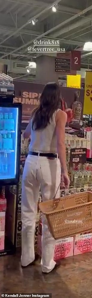 Proud moment: The businesswoman was seen walking over to her 818 tequila brand and adding a bottle into her shopping basket