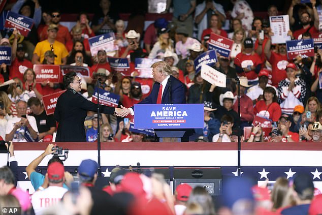 Former President Donald Trump (center) hit out at Cheney on his new social media app Truth shortly after Wyoming GOP primary results were in