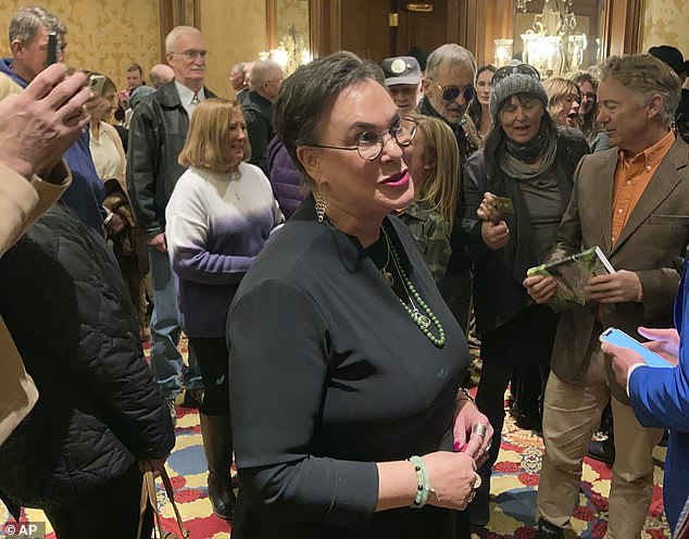 Harriet Hageman (center) talks to supporters at a campaign event in early March, alongside Republican Sen. Rand Paul (right)