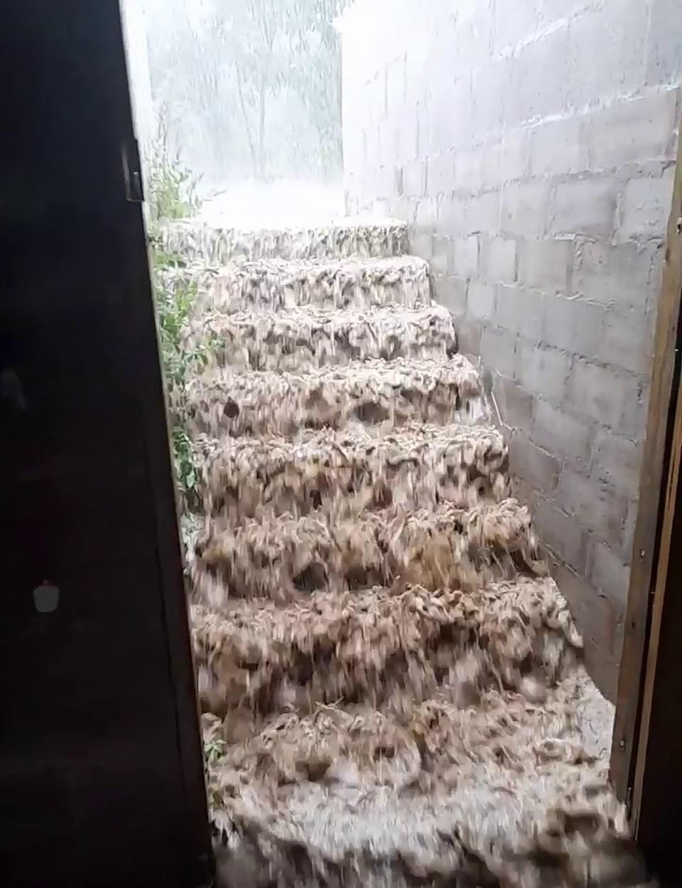 CORNWALL: A downstairs deluge cascades down steps at St Mabyn in Cornwall during torrential downpours of rain on Tuesday