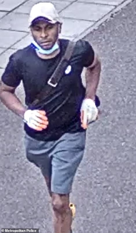 The man was wearing shorts, a dark coloured T-shirt, bright blue trainers, a white baseball cap and white patterned builder-style gloves