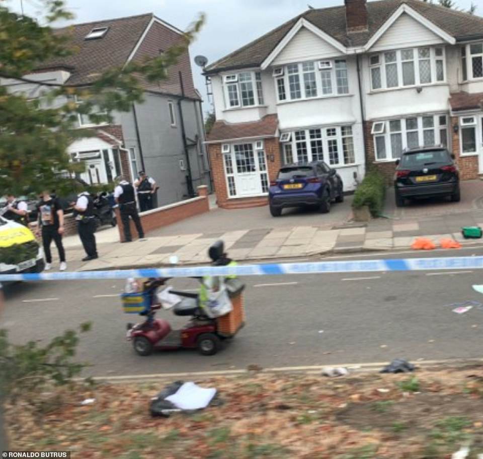 The 87-year-old victim's mobility scooter, which was well-known amongst locals who often saw him playing the accordion on it outside Greenford station and Tesco, was left at the scene of the crime - pictured yesterday