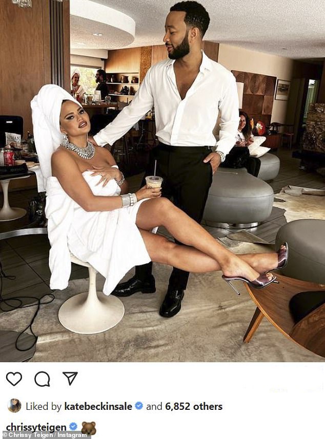 Swanking about: Over on her main page, she posted a behind-the-scenes snap of herself in the process of glamming up with her husband