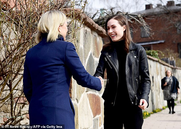 Mrs Marin has charted a course into NATO, which will almost certainly be followed into the alliance by Sweden (pictured, Mrs Marin meets Swedish PM Magdalena Andersson)