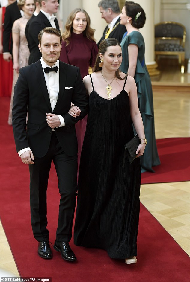 Ms Marin pictured while pregnant with her husband Markus Raikkonen at Finland's 100th Anniversary Independence Day Reception in Helsinki