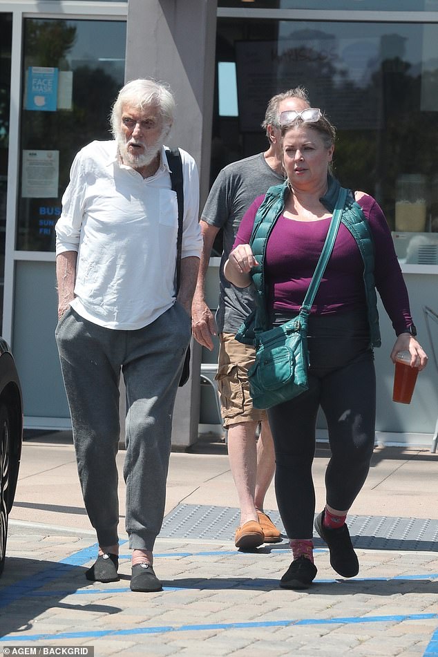 Laid back: The Mary Poppins star looked relaxed in a long sleeve white cotton top, grey sweatpants, and black shoes