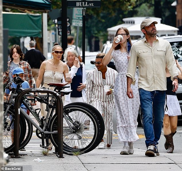 Too cool for school: Ben's daughter Seraphina, 13, rocked '70s-chic feather hair with her '90s grunge-style outfit featuring a gray graphic T-shirt