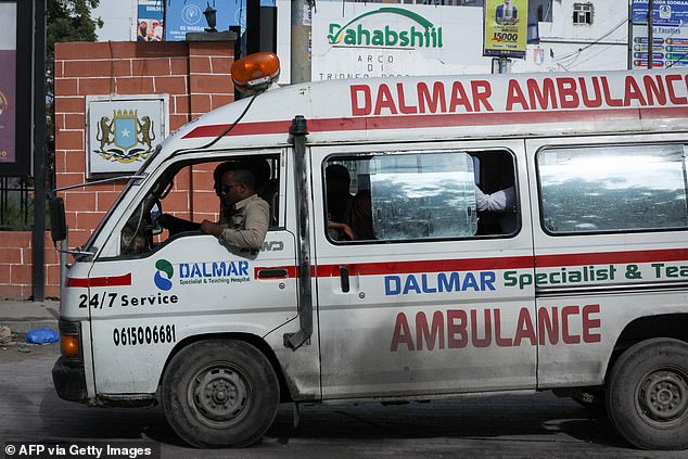 An ambulance is seen near the the site of explosions in Mogadishu today