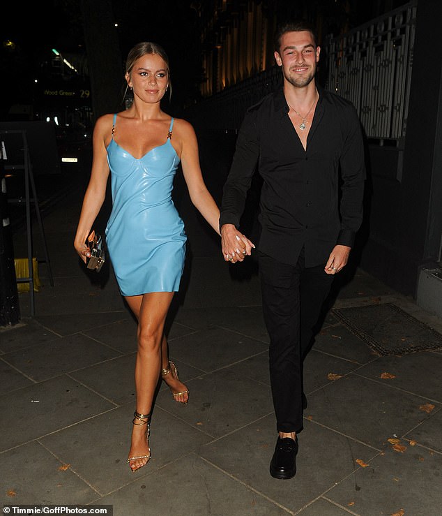 Looking good: The dancer put on a very leggy display in a leather blue dress, while Andrew looked dashing in an all black ensemble