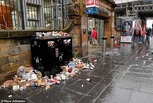 Visitors to the Edinburgh Fringe in the Scottish city will likely encounter mounds of rubbish after workers demanded higher pay, affecting bin collections, street and closing recycling centres. Pictured: Piles by the station