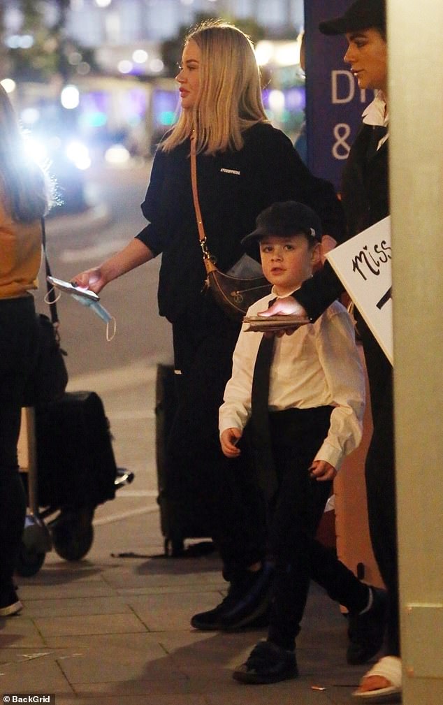 Jessika was greeted by her sister Eliza and her son who were seen carrying a large cardboard sign with her name