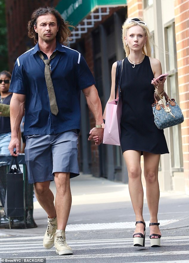 Endless legs: The 33-year-old Ted Lasso actress punctuated the leggy look with a pair of towering black and beige platforms