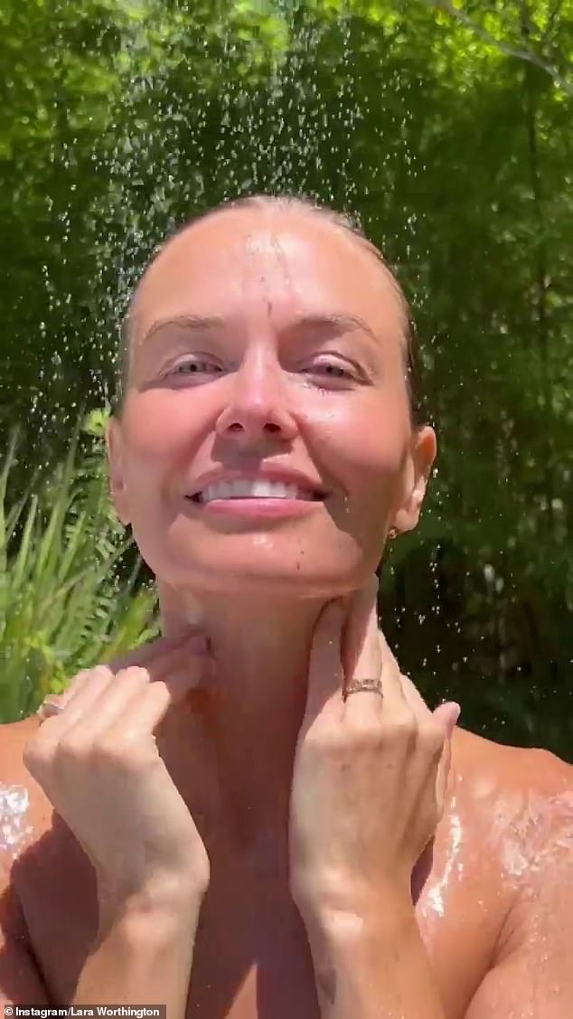 Lara Worthing filmed herself showering naked outdoors on Tuesday as she spruiked Emma Lewisham's famous beauty brand