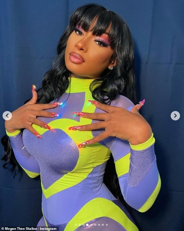 Incredible: Taking to Instagram the rapper, 27, looked sensational as she dressed to impress in a figure hugging blue and green paneled jumpsuit