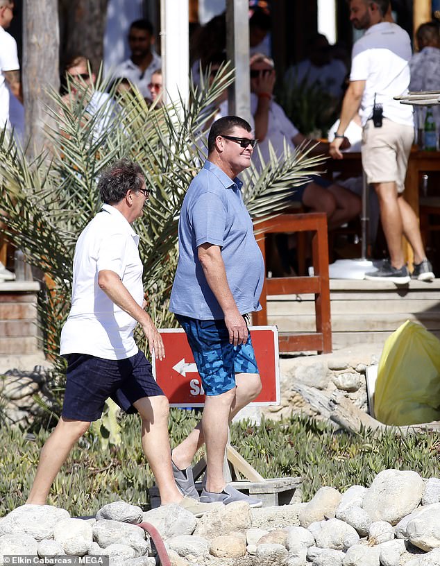 The son of late media mogul Kerry Packer dressed casually for his Euro trip in a light blue polo shirt, patterned shorts, sneakers and sunglasses