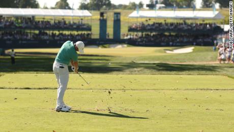 McIlroy plays his shot from the 15th tee during the third round.