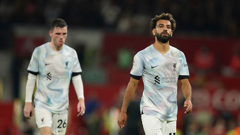 Liverpool&#39;s Mohamed Salah and his teammate Andrew Robertson leave the pitchat the end of the English Premier League soccer match between Manchester United and Liverpool at Old Trafford stadium, in Manchester, England, Monday, Aug 22, 2022. (AP Photo/Dave Thompson)