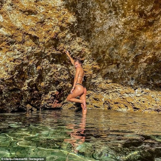 Sunshine glow: Clara posed by the sea for another stunning beach shot