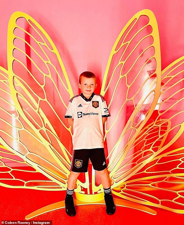 Sporty: The boys wore their football kits as usual as they posed for cute family snaps together at the fun museum