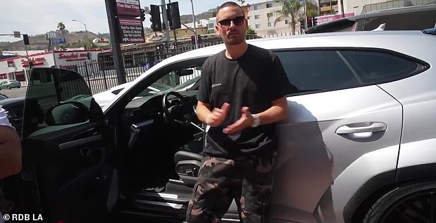 He's okay: His latest post comes just days after Scott survived a terrifying car crash in his Lamborghini Urus; he is pictured showing off the car in an old video