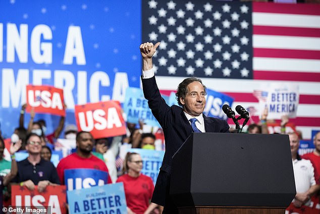 Rep. Jamie Raskin gives a thumbs up to the crowd Thursday night at Richard Montgomery High School in Rockville, Maryland